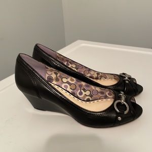 Black leather coach peep toe leather wedges. Minor wear and tear on bottoms.